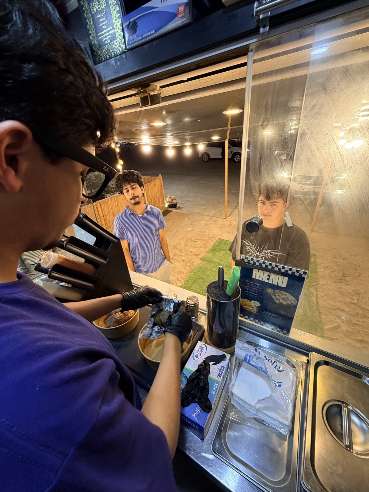 Customers being served at the Spudlicious truck window